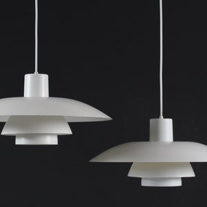 Pair of Poul Henningsen PH 4 size 4/3 Pendant old version. Made by  Louis Poulsen A/S of metal with white lacquer in Denmark mid century