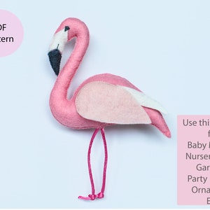 May include: A pink felt flamingo with white and pink wings. The flamingo is standing on a white background. The text "PDF Pattern" is in a pink circle in the upper left corner of the image. The text "Use this pattern for Baby Mobiles Nursery Decor Garlands Party Favours Ornaments Etc." is in a pink rectangle in the lower right corner of the image.
