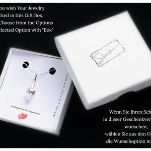 May include: A white gift box with a silver necklace inside. The necklace has a clear crystal pendant. The box has the text "If You wish Your Jewelry packed in this Gift Box, please Choose from the Options Your selected Option with "Box"" and "Handmade for You in Germany" printed on it.