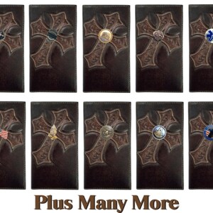 May include: Ten different brown leather wallets with a cross design and various metal inlays. The inlays include a cross, a star, an eagle, a flag, a hand with a prayer, a ship, a medical symbol, and a police badge. The text "Plus Many More" is at the bottom of the image.