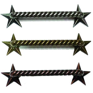 May include: Three star-shaped drawer pulls with a twisted rope design. The pulls are available in silver, gold, and copper finishes.