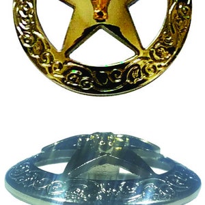 May include: Two decorative cabinet knobs. The top knob is gold-colored with a star and bull design within a decorative border. The bottom knob is silver-colored with a star design and a decorative border. The knobs have a gold-colored base.