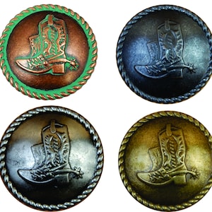 May include: Four round metal buttons with a rope-like border. Each button features a raised design of a cowboy boot with a spur. The buttons are in different colors: copper with a green border, black, silver, and gold.