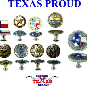 May include: Assortment of 12 Texas themed cabinet knobs. The knobs are made of metal and feature various designs including the Texas flag, a star, and the words "God Bless Texas".