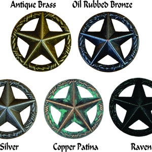 May include: Six different finishes of a metal Texas star with a barbed wire border. The finishes are Antique Brass, Oil Rubbed Bronze, Old Silver, Copper Patina, and Raven.
