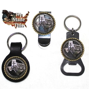 May include: Five different keychains featuring a silver Texas outline with a cross and a gold rope design. The keychains include a bottle opener, a money clip, a leather keychain, and two different styles of key rings.