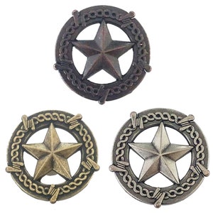 May include: Three metal Texas star drawer pulls with a barbed wire design. The pulls are in different finishes: antique brass, oil rubbed bronze, and antique nickel.