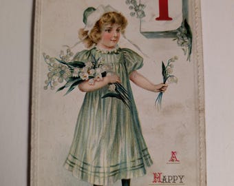 Antique 1911 A Happy New Year January 1 Girl with Flowers Made In Germany R.P.O. Postcard NEW YEAR SERIES