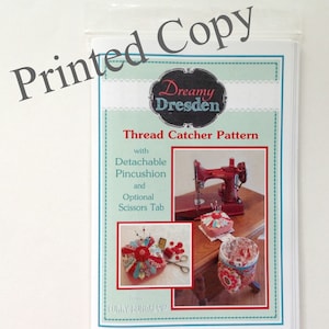 May include: A sewing pattern for a thread catcher with a detachable pincushion and optional scissors tab. The pattern is called "Dreamy Dresden" and is from Curry Bungalow.