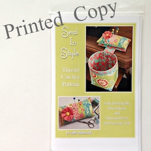 May include: Sew In Style Thread Catcher Pattern with a detachable pincushion, optional posy, and scissors tab. The pattern features a green and pink floral design.