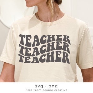 May include: A white t-shirt with the word "TEACHER" repeated three times in a retro, wavy font. The text is in dark gray.