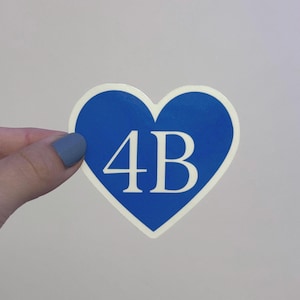 May include: Blue heart-shaped sticker with white outline and the text "4B" in white.