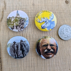 May include: A set of three ceramic mugs with a speckled, matte finish. The mugs are in shades of cream, light gray, and dark gray. Each mug has a simple, minimalist design and a rounded handle.