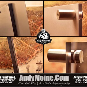 May include: A close-up of two metal wall mounts for hanging artwork. The mounts are made of brushed silver metal and have a cylindrical shape. The mounts are attached to a white wall. The text "AndyMoine.Com Fine Art Black & White Photography" is visible at the bottom of the image. The text "Aluminum Print Sizes: 8"x12"/10"x15"/12"x18"/16"x24" 20"x30"/24"x36"/30"x45" Acrylic Print Sizes: 10"x15"/12"x18"/16"x24" 20"x30"/24"x36"/30"x45" is also visible at the bottom of the image.