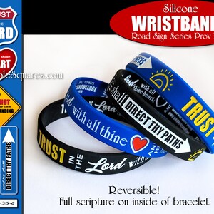 May include: Three silicone wristbands with the text "Trust in the Lord" and "Lean not unto thine own understanding" in black and yellow lettering on a blue and black background. The wristbands are reversible and feature the full scripture on the inside of the bracelet. The text "Proverbs 3:5-6" is also included.