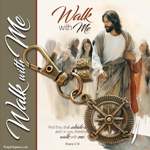 May include: A bronze-colored keychain with a compass rose design and the words "Walk with Me." The keychain has a clasp and a small charm. The background features a religious image with the text "And thou shalt abide...walk with me."