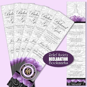 May include: A stack of white bookmarks with purple floral accents and the text "Beloved Spirit Daughters of God." The bookmarks also feature the Relief Society logo and the words "Relief Society Declaration Bookmarks."