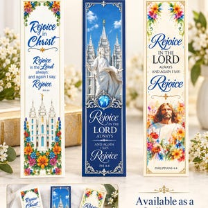 May include: Three rectangular bookmarks featuring religious themes. One white bookmark shows a temple with colorful flowers and text. A blue bookmark displays a statue of Jesus and a temple. A third white bookmark features Jesus with flowers and text.