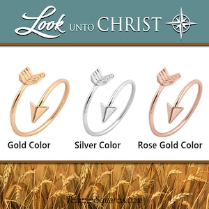 May include: Three arrow rings in gold, silver, and rose gold colors. The rings are simple and delicate, with a small arrow pointing to the right. The rings are a great way to add a touch of style to any outfit.