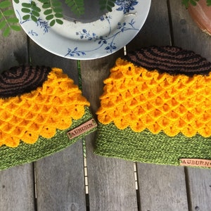 Crochet hat looking like sunflower. yellow petals created using crocodile stitch