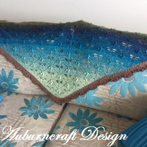 Triangle shape shawl, made from fingering weigh yarn with dragonflies,, lace edge border