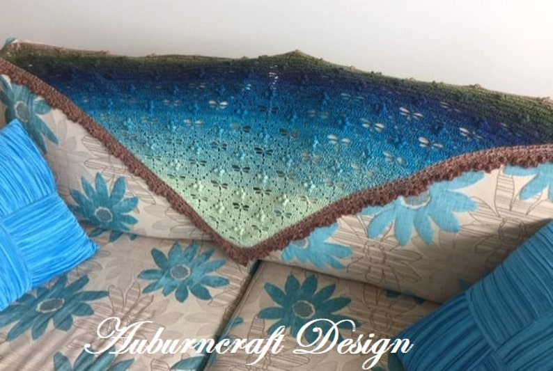 Triangle shape shawl, made from fingering weigh yarn with dragonflies,, lace edge border