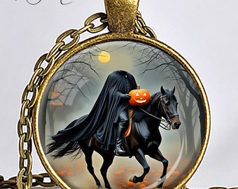 May include: Bronze-toned pendant necklace featuring a circular image of the Headless Horseman riding a black horse through a spooky forest. The horseman carries a jack-o'-lantern. The pendant is suspended from a matching chain. The text "Headless Horseman" is at the bottom.