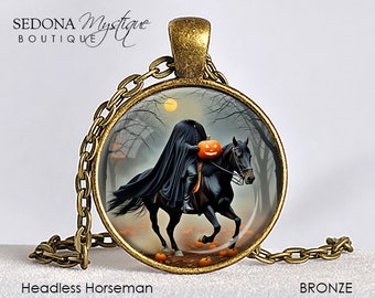 May include: Bronze-toned pendant necklace featuring a circular image of the Headless Horseman riding a black horse through a spooky forest. The pendant has a chain and clasp. The words "Headless Horseman" and "BRONZE" are printed on the image.