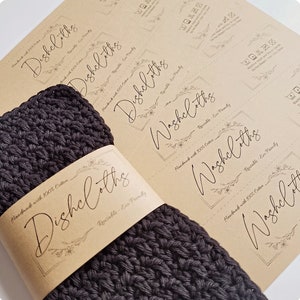 May include: A set of black crocheted dishcloths with a brown paper label that reads "Handmade with 100% Cotton Dishcloths Reusable - Eco Friendly".