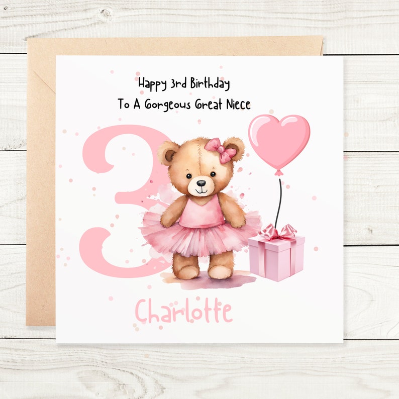 May include: A square birthday greeting card featuring a brown teddy bear wearing a pink tutu and bow. The card displays the text Happy 3rd Birthday To A Gorgeous Great Niece and Charlotte, with a large pink number 3, a heart balloon, and a gift.