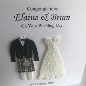 K&ouml;nnte beinhalten: Eine wei&szlig;e Karte mit einer Schwarzwei&szlig;illustration eines Brautpaares. Die Karte lautet "Herzlichen Gl&uuml;ckwunsch Elaine & Brian Zu Ihrem Hochzeitstag 28. Februar 2019".