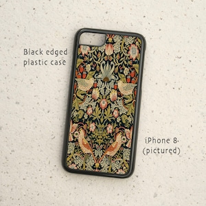May include: Black plastic phone case with a floral pattern featuring birds and flowers. The case is designed for an iPhone 8.