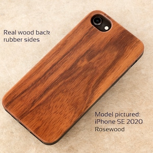 May include: A brown wood phone case with a black rubber bumper. The case is made of real wood and has a rubberized finish on the sides. The case is pictured on an iPhone SE 2020, Rosewood.