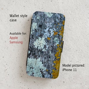 May include: A wallet-style phone case with a blue, white and yellow abstract pattern. The case is available for Apple and Samsung phones. Model pictured: iPhone 11.