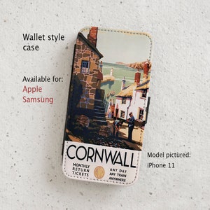 May include: A phone case with a vintage travel poster design featuring a seaside village in Cornwall, England. The poster includes the text "CORNWALL" and "MONTHLY RETURN TICKETS". The case is available for Apple and Samsung phones. The model pictured is an iPhone 11.