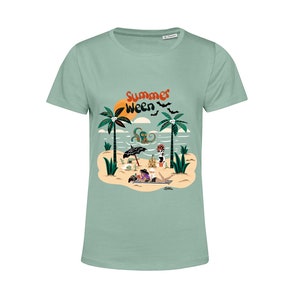 May include: A light green t-shirt featuring a graphic print of a beach scene with palm trees, a sunset, an octopus, and a skeleton. The text "Summer Ween" is printed on the shirt.