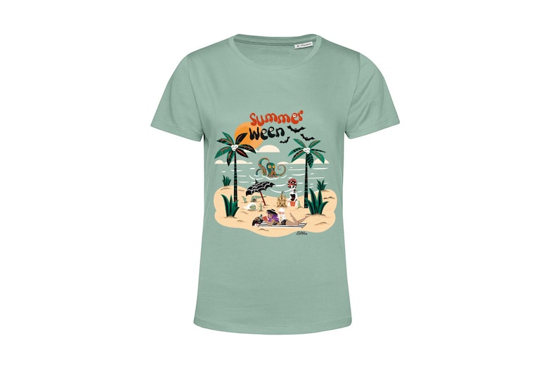 May include: A light green t-shirt featuring a graphic print of a beach scene with palm trees, a sunset, an octopus, and a skeleton. The text "Summer Ween" is printed on the shirt.