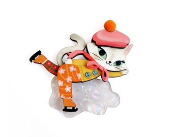 Broche gatita patinando sobre hielo