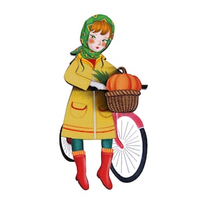 Girl with bicycle brooch