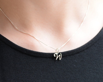 Tiny initial necklace. Sterling silver cursive letter charm.