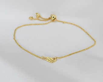 14K Gold Angel wing Bracelet - 14k gold tiny angel wing adjustable bracelet. Delicate bracelet