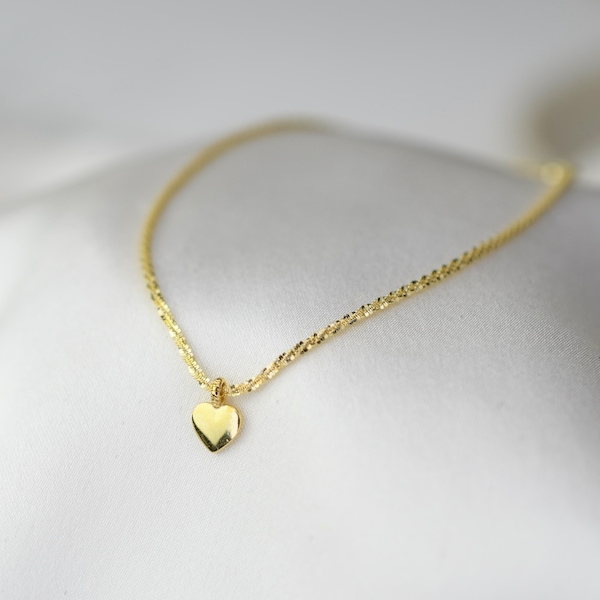 14K Gold Sparkle Chain Heart Bracelet. 14K Yellow Gold 1.2mm Sparkle Chain Bracelet with Tiny Heart Charm