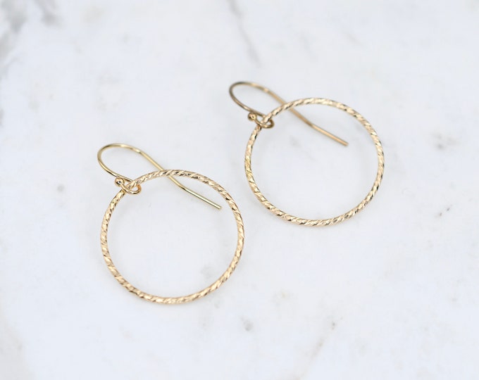 14K gold circle earrings. 14K yellow gold circle earrings.