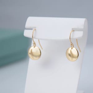 14K solid gold earrings. 14K solid gold tiny disc earrings. Tiny gold disc earrings. Simple earrings. Dainty earrings. Gift for her. image 5