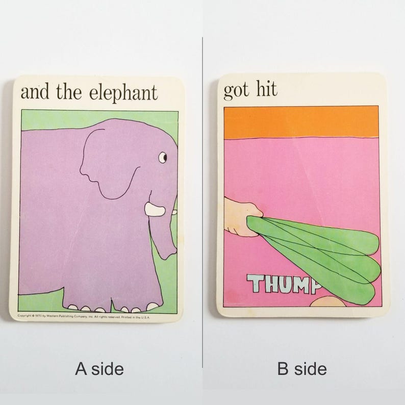 an image showing both sides of the same rectangular card. Side A has an illustration of a large purple elephant and the text 'and the elephant' at the top. Side B has an illustration of a hand holding a green bat on a pink background and the text 'got hit' at the top.