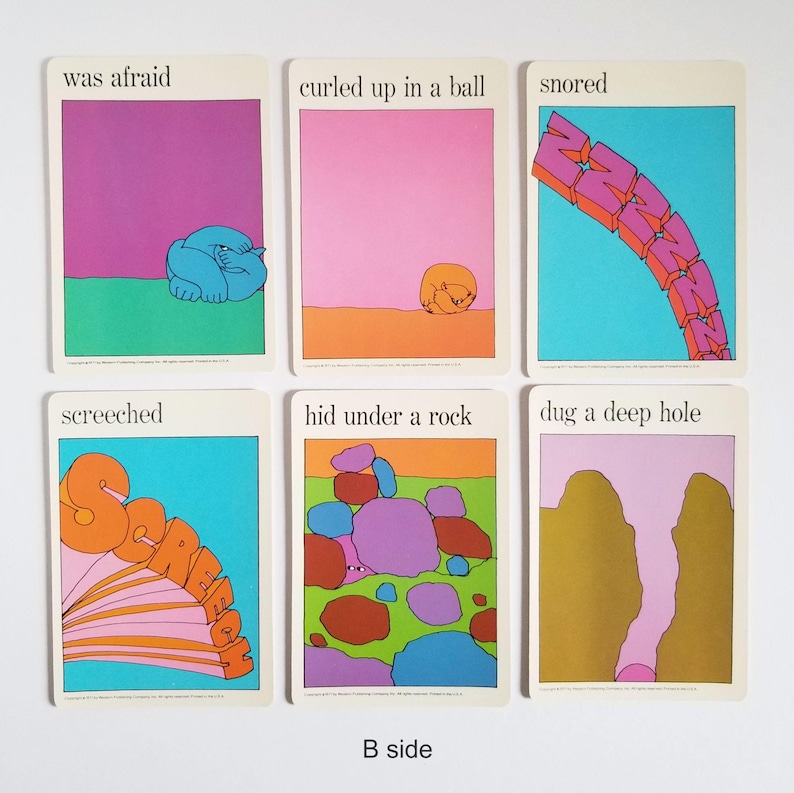 The other side of the same set of 6 vintage rectangular cards with visual illustrations of action verbs and text in black across the top. The text on the cards reads 'was afraid', 'curled up in a ball', 'snored, 'screeched', 'hid under a rock', and 'dug a deep hole'. The cartoon style illustrations are very colourful and have a white border around the edges.