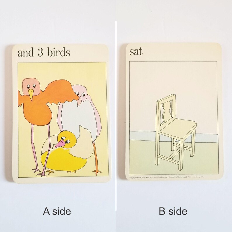 an image showing both sides of the same rectangular card. Side A has an illustration of 3 birds and the text 'and 3 birds' at the top. Side B has an illustration of a yellow chair on a green background and the text 'sat' at the top.