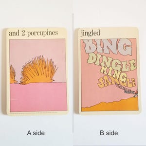 an image showing both sides of the same rectangular card. Side A has an illustration of 2 orange porcupines on a pink background and the text 'and 2 porcupines' at the top. Side B has an illustration of the words Bing Dingle Ring Jangle Tinkle Clink on a pink background and the text 'jingled' at the top.