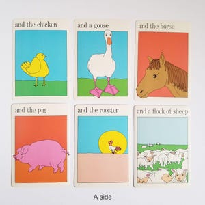 A set of 6 vintage rectangular cards with illustrations of animals and text on both sides. The text on the cards reads 'and the chicken', 'and a goose', 'and the horse', 'and the pig', 'and the rooster', 'and a flock of sheep'. The cartoon style illustrations are very colourful and have a white border around the edges. The text is in black across the top.