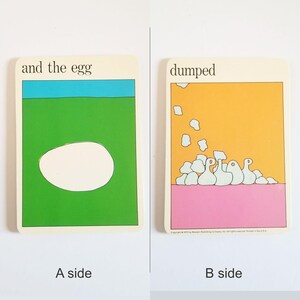 an image showing both sides of the same rectangular card. Side A has an illustration of an egg on a blue & green background and the text 'and the egg' at the top. Side B has an illustration of a pile of rubble on a pink & yellow background and the text 'dumped' at the top.